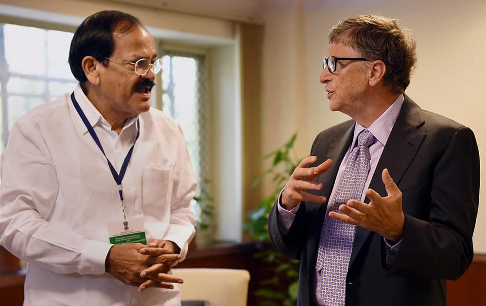 Urban Development Minister Venkaiah Naidu talks to Microsoft co-founder Bill Gates in New Delhi.