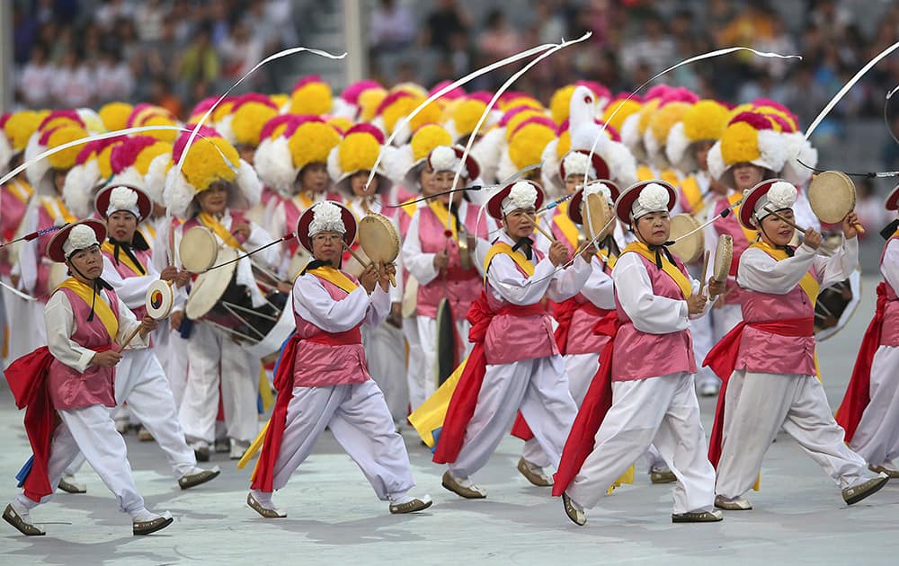 Dancers perform during the opening ceremony for the 17th Asian Games at Incheon Asiad Main Stadium in Incheon, South Korea.