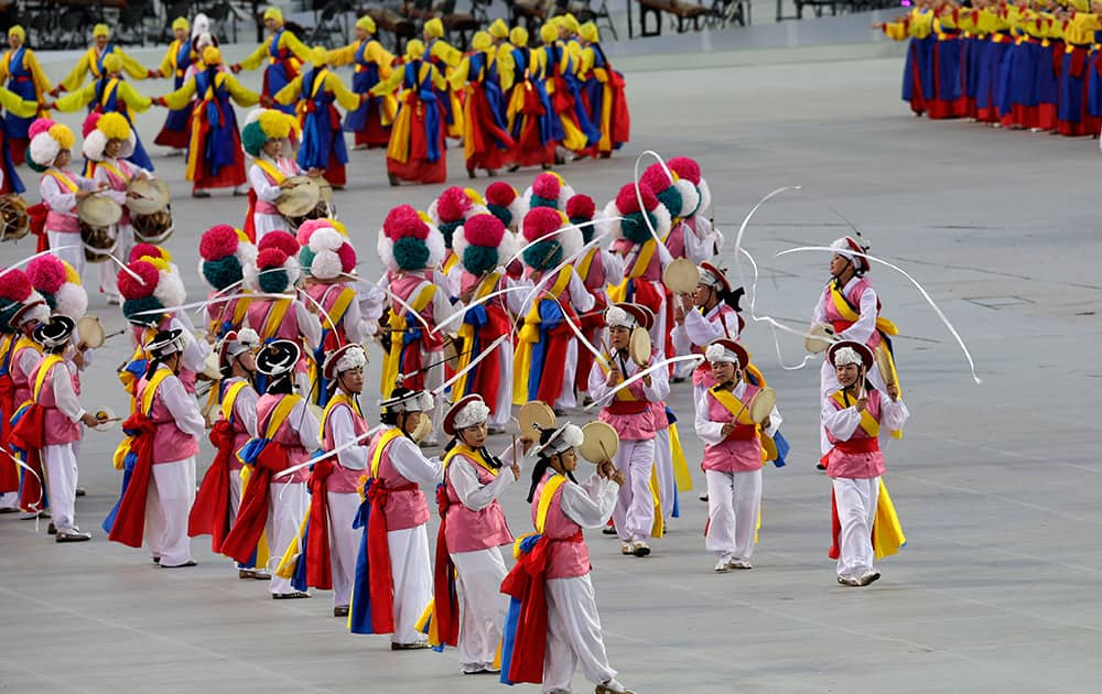 Dancers perform on stage for the welcoming performance ahead of the start to the opening ceremony for the 17th Asian Games in Incheon, South Korea.