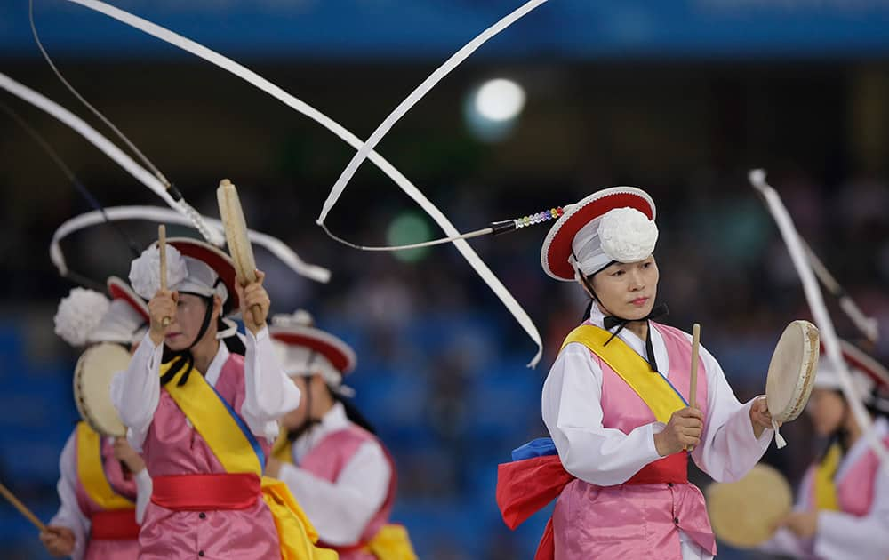 Artists perform during the opening ceremony for the 17th Asian Games in Incheon, South Korea.