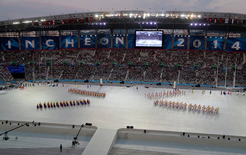 Dancers perform during the opening ceremony for the 17th Asian Games at Incheon Asiad Main Stadium in Incheon, South Korea.