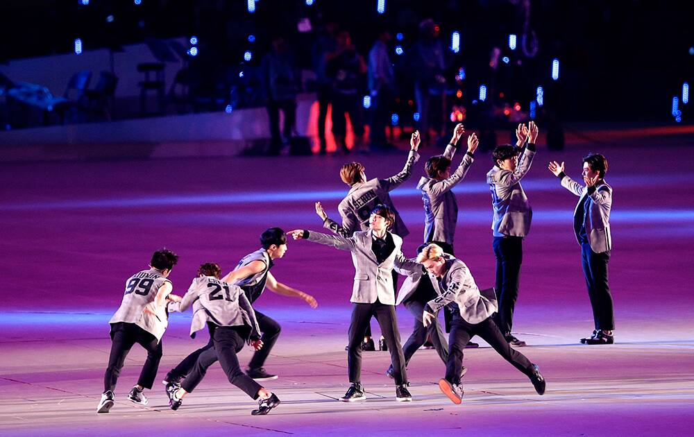 K-pop performers entertain the audience ahead of the opening ceremony for the 17th Asian Games in Incheon, South Korea.