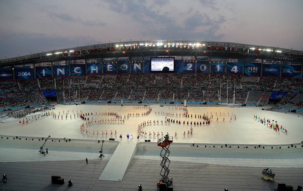 Dancers perform during the opening ceremony for the 17th Asian Games at Incheon Asiad Main Stadium in Incheon, South Korea.