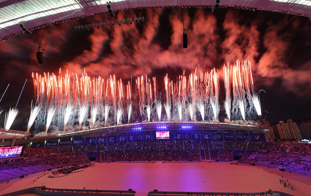 Fireworks explode over Incheon Asiad Main Stadium during the opening ceremony for the 17th Asian Games in Incheon, South Korea.