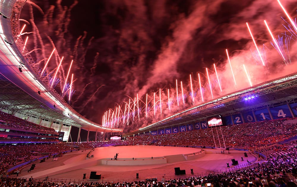 Fireworks explode over Incheon Asiad Main Stadium during the opening ceremony for the 17th Asian Games in Incheon, South Korea.