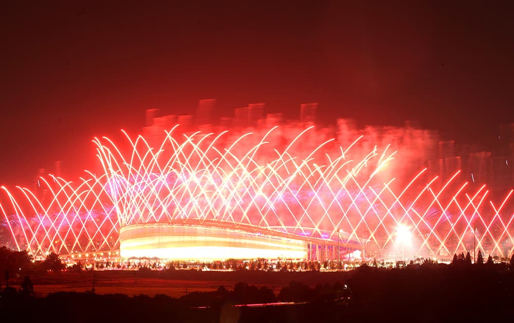 Fireworks explode over Incheon Asiad Main Stadium during the opening ceremony for the 17th Asian Games in Incheon, South Korea.