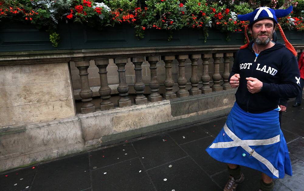 A man wearing a Saltire kilt is seen on the street in Edinburgh, Scotland. Scottish voters have rejected independence and decided that Scotland will remain part of the United Kingdom. 