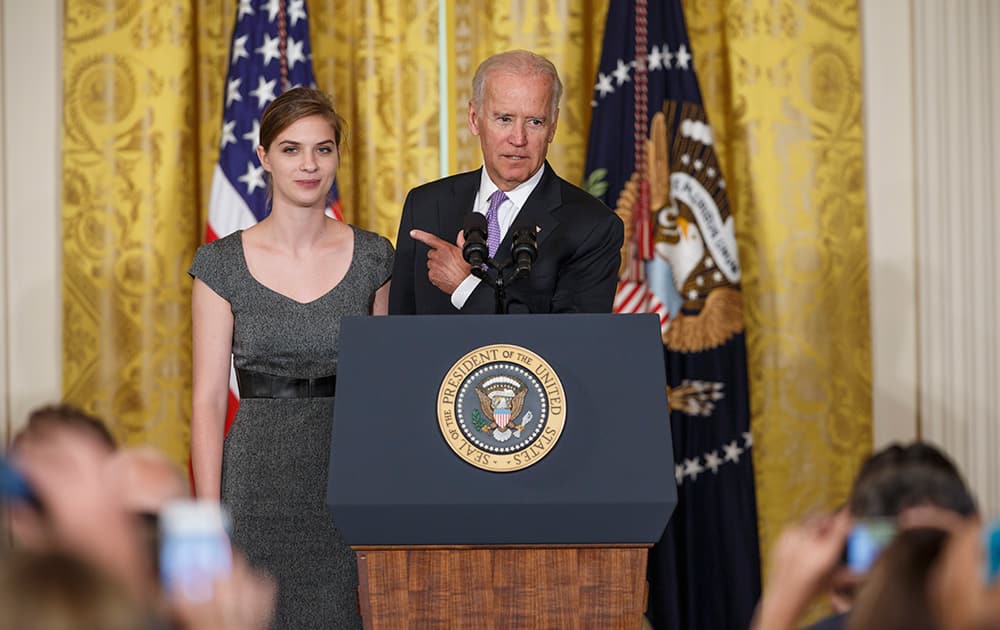 Calling her a hero, Vice President Joe Biden praises Lilly Jay who talked about the impact on her life after she was sexually assaulted as a freshman at Amherst College in Massachusetts, at the White House in Washington.