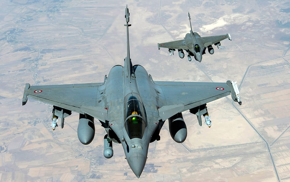 This image provided by the French Army's video and photo department ECPAD shows two Rafale jet fighters flying over Iraq on Friday. Joining US forces acting in Iraqi skies, French fighter jets struck Friday against the militant Islamic State group, destroying a logistics depot, Iraqi and French officials said.