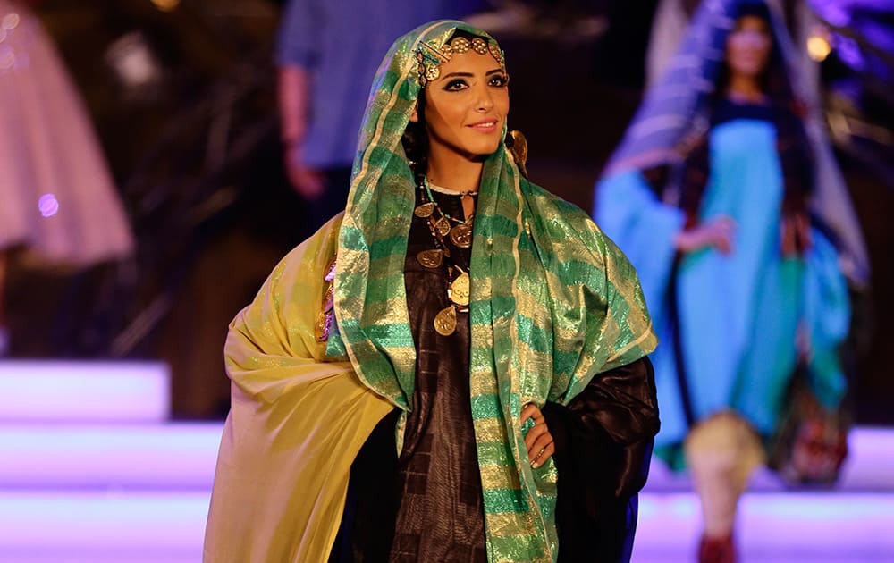 Sara William displays her dress on stage during the Miss Egypt competition pre-final at the Saladin Citadel in Cairo, Egypt.