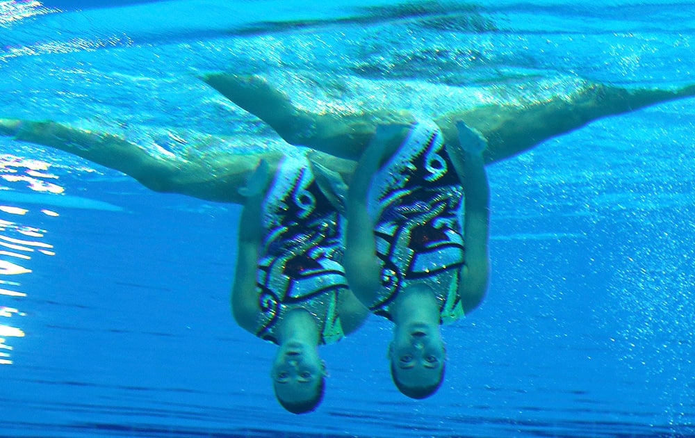 Kazakhstan's Yekaterina Nemich and Amina Yermakhanova swim under water during the synchronized swimming duets technical routine at the 17th Asian Games in Incheon, South Korea.