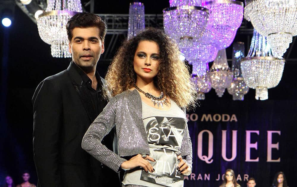 Bollywood filmmaker Karan Johar with actor Kangna Ranaut during the unveiling of Vero Moda collection designed by him in Mumbai.