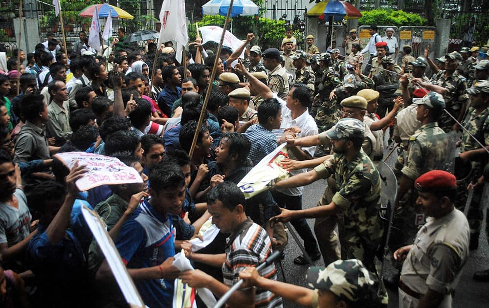 Security personnel stop Chatra Yuva Parishad students who were protesting for their demands in Guwahati.