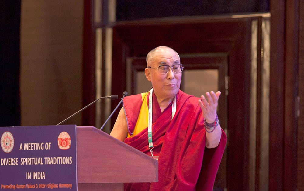 Tibetan spiritual leader the Dalai Lama speaks during an inter-faith meeting in New Delhi.