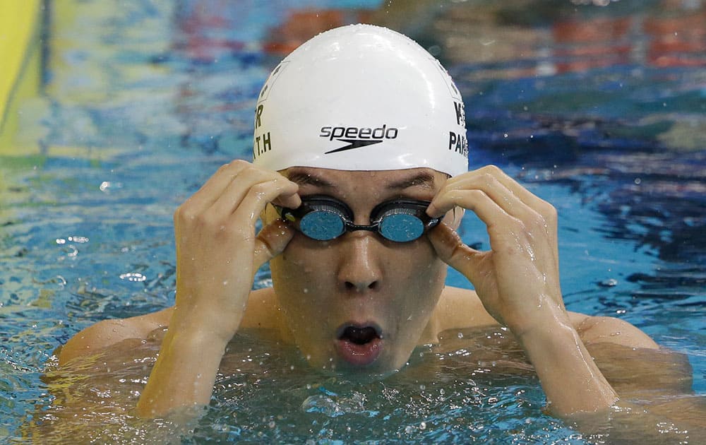 South Korea's Park Tae-hwan adjusts his goggles after competing a men's 200-meter freestyle swimming heat at the 17th Asian Games in Incheon, South Korea.