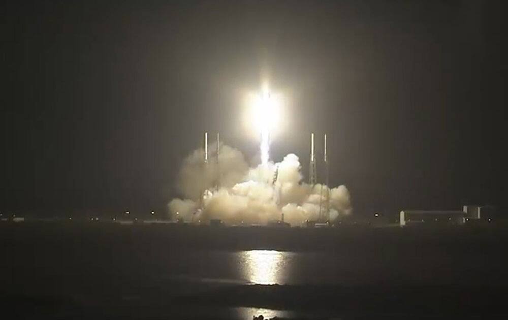 In this framegrab provided by NASA, the SpaceX cargo ship lifts off, rocketing toward the International Space Station.