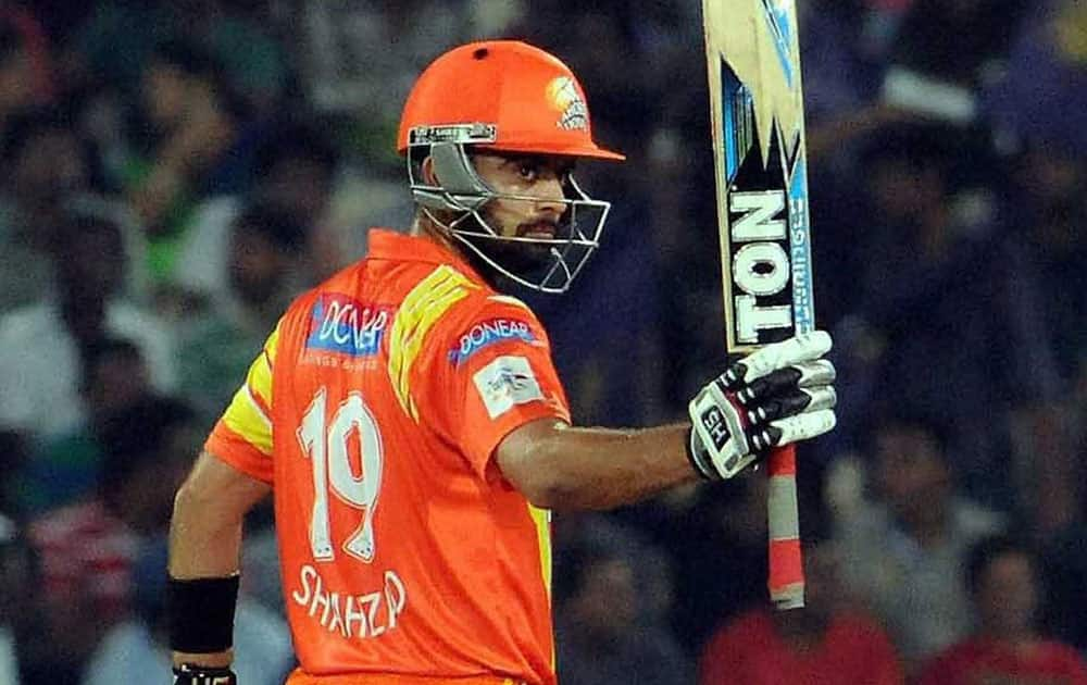 Ahmed Shehzad of Lahore Lions celebrates after his half century against Kolkata Knight Riders during a CLT20 match in Hyderabad.