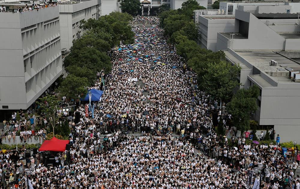 Students stage a rally at the Chinese University of Hong Kong campus in Hong Kong.  Thousands of Hong Kong students boycotted classes Monday to protest Beijing’s decision to restrict electoral reforms in a weeklong strike marking the latest phase in the battle for democracy in the southern Chinese city.