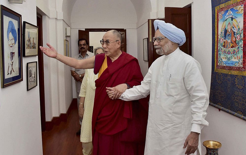 Former Prime Minister Manmohan Singh during a meeting with Tibetan Spiritual leader, Dalai Lama at his residence in New Delhi.