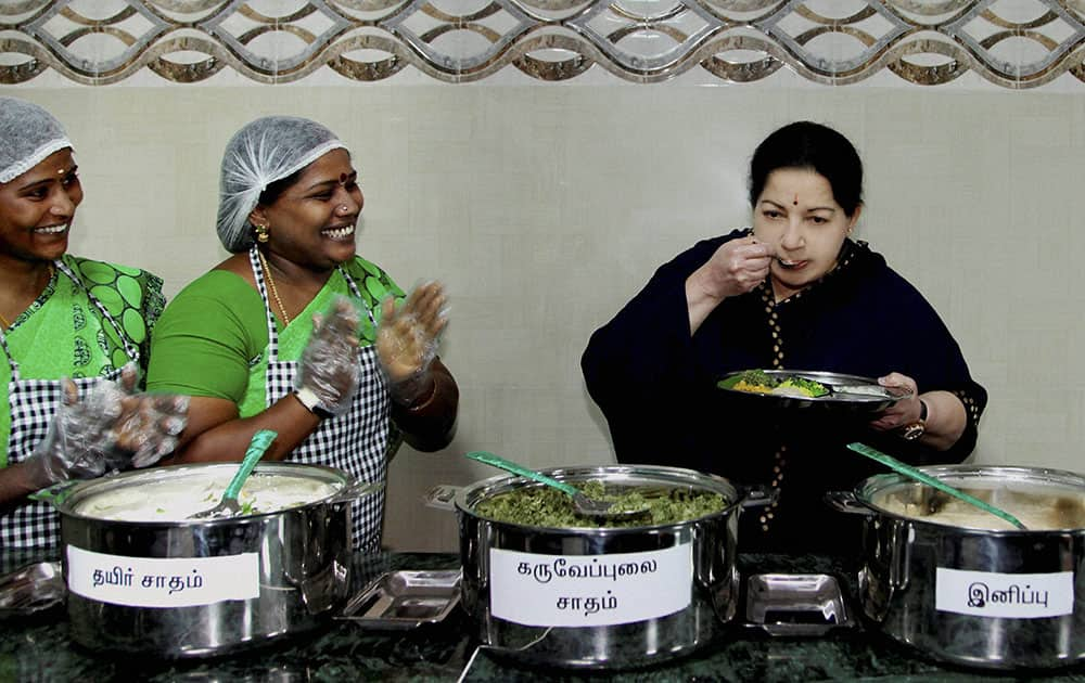 Tamil Nadu CM J Jayalalitha tasting food after launching an Amma Unavagam (Amma Canteen) at a government hospital in Chennai.