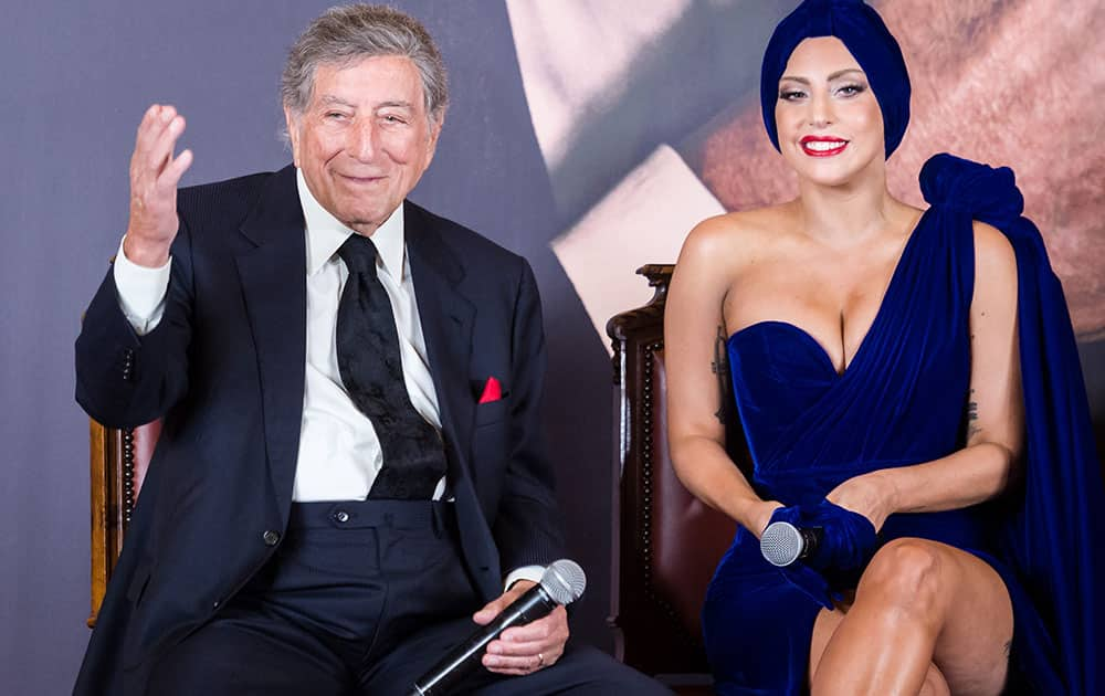 Lady Gaga, right, and Tony Bennett talk during a media event at the Brussels' city hall.