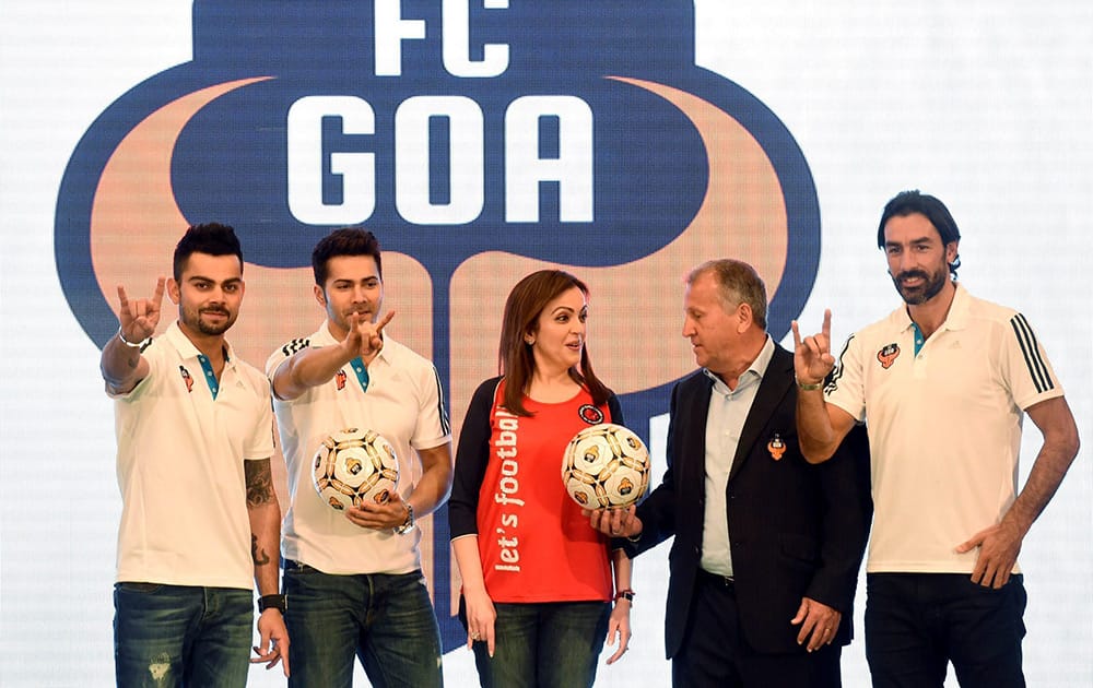 FC Goa’s coach Zico and marquee player Robert Pires along with Nita Ambani, founding chairperson, Football Sports Development co-owner, cricketer and co-owner of the club Virat Kohli and actor Varun Dhawan during a press conference in Mumbai.