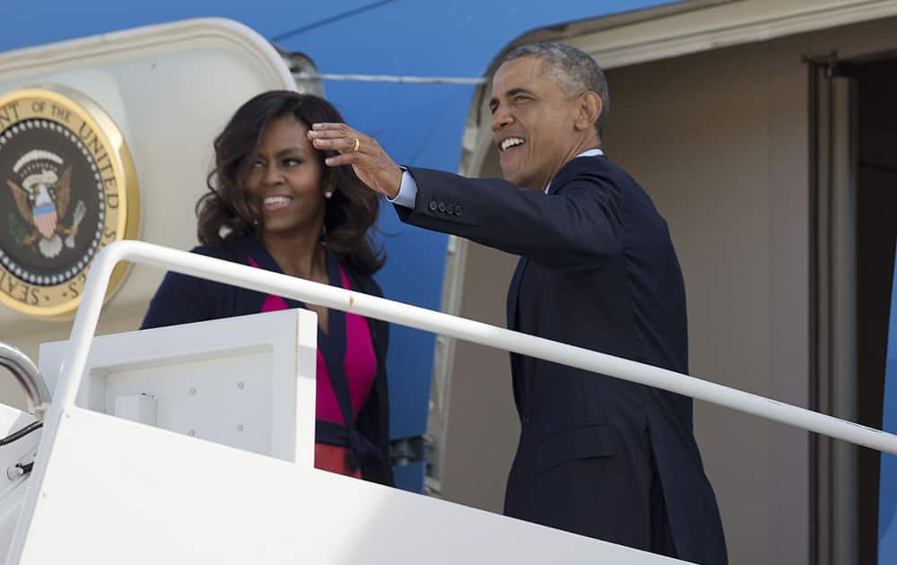 President Barack Obama and first lady Michelle Obama board Air Force One at Andrews Air Force Base, Md. Obama is traveling to New York for three days of talks with foreign leaders at the annual United Nations General Assembly.