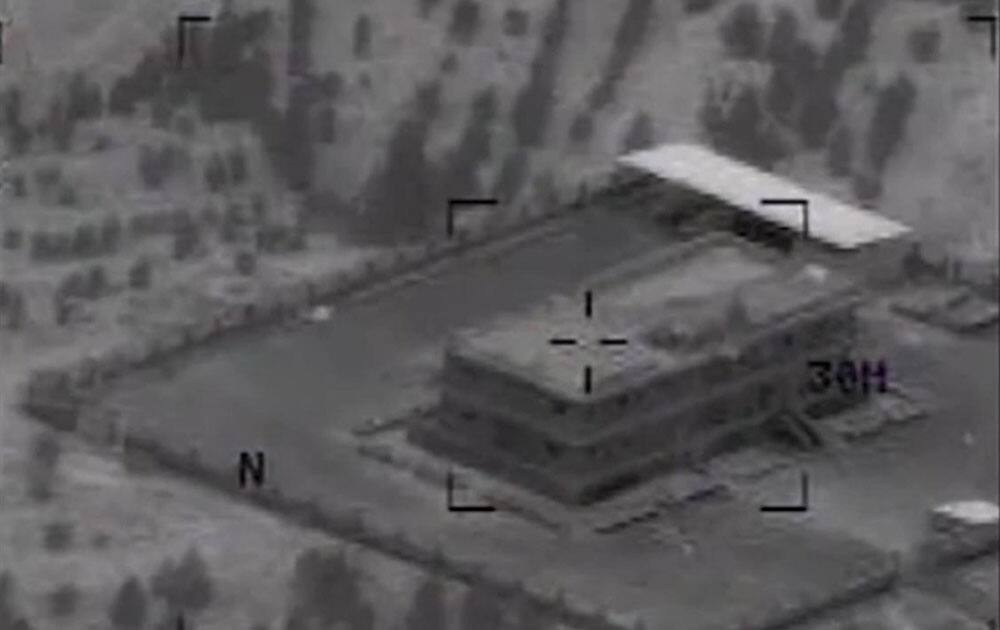 This still image made from video released by the US Central Command shows a structure in Tall Al Qitar, Syria moments after a US airstrike.