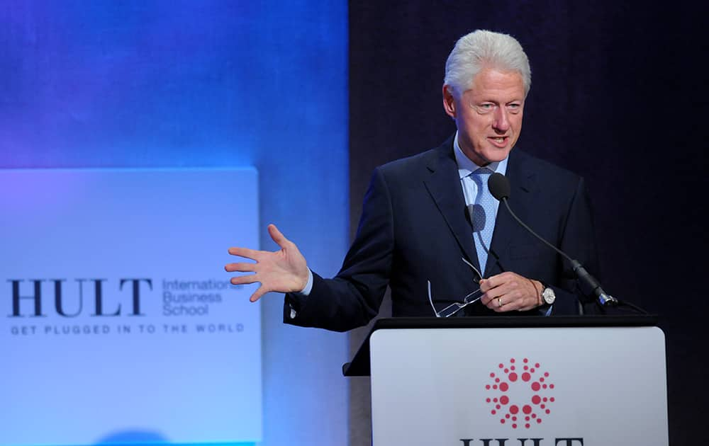 Former President Bill Clinton announces the Hult Prize winner onstage during The Hult Prize Finals and Awards Dinner 2014 at the 10th Clinton Global Initiative Annual Meeting in New York.