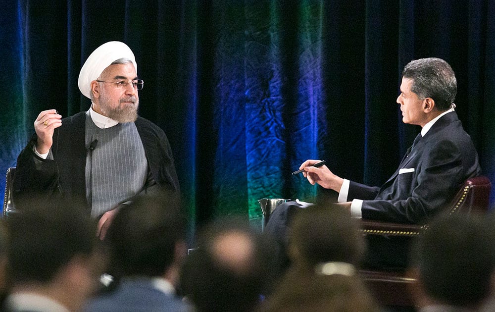 Iran's President Hassan Rouhani, left, listens as moderator Fareed Zakaria asks questions following the President's keynote address at New America, a public policy institute and think tank, in New York. 