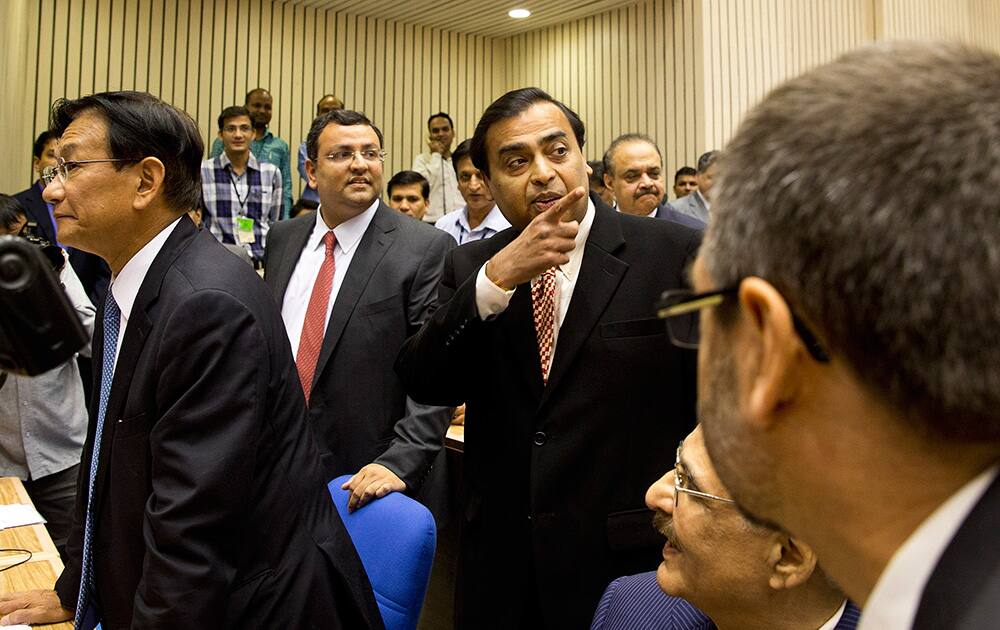 Maruti Suzuki India, Managing Director Kenichi Ayukawa, Tata group Chairman Cyrus Mistry, and Reliance Industries, Chairman and Managing Director Mukesh Ambani, attend the launch of 'Make in India' initiative in New Delhi.