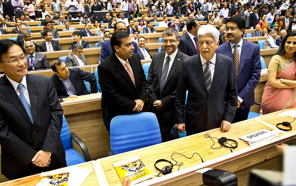 Standing from left to right, Maruti Suzuki India, Managing Director Kenichi Ayukawa, Reliance Industries, Chairman and Managing Director Mukesh Ambani, Bosch India, Executive Director, Franz Hauber,Wipro Chairman Azim Premji, Aditya Birla Group Chairman Kumar Mangalam Birla, left and ICICI Bank, CEO Chanda Kochhar attend the launch of 'Make in India' initiative in New Delhi.