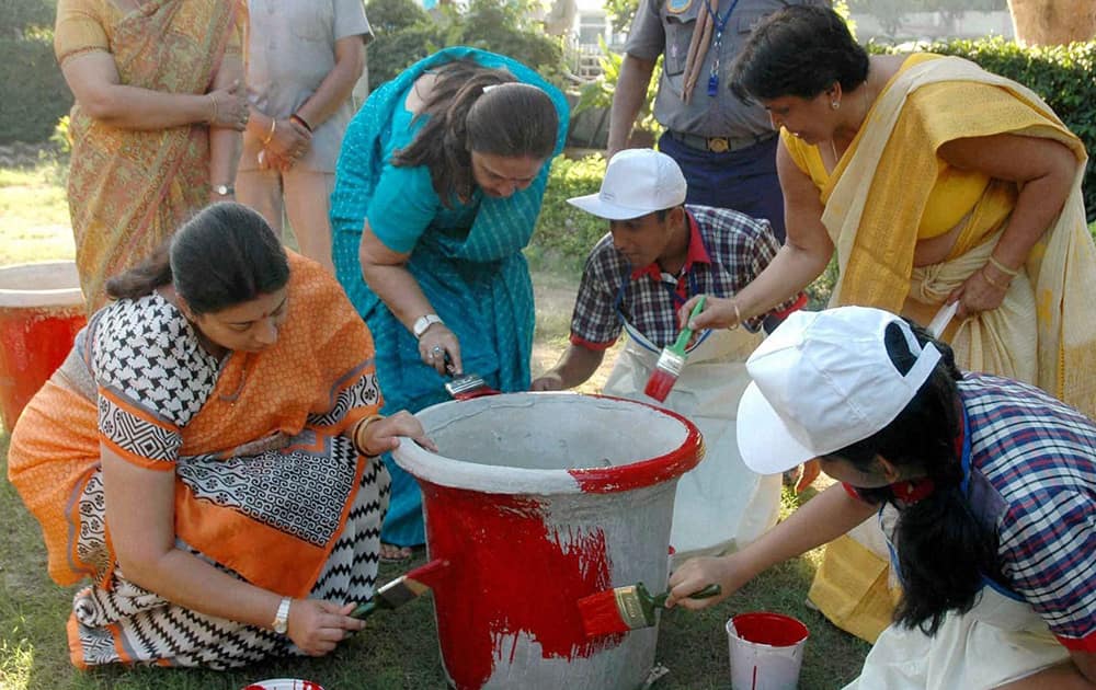 Union Human Resource Development Minister Smriti Irani participates in Swachh Bharat Abhiyan’ (Clean India Mission), at a school in New Delhi.