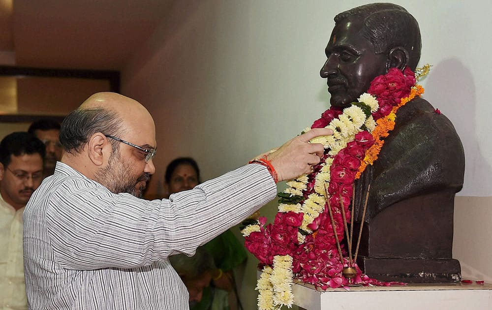 BJP President Amit Shah paying tributes to Pandit Deen Dayal Upadhyay on the occasion of 98th birth anniversary in New Delhi.