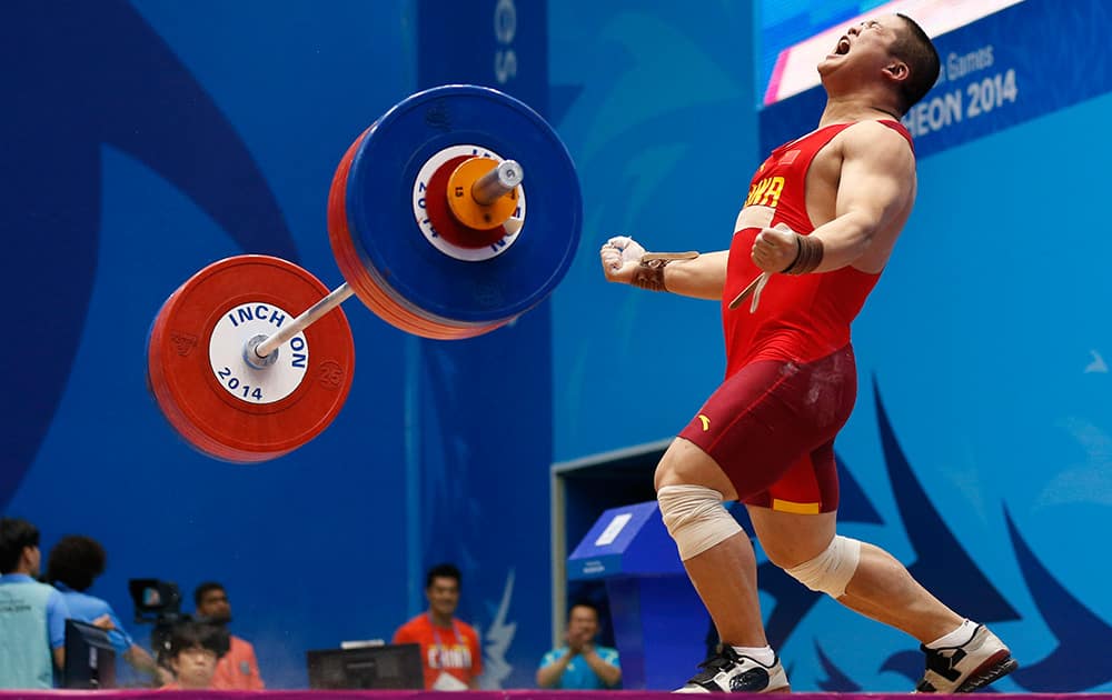 China's Liu Hao celebrates after successfully completing a lift during the men's 94kg weightlifting competition at the 17th Asian Games in Incheon, South Korea.