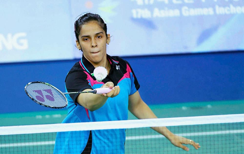 Saina Nehwal plays a shot during the womens singles badminton match at the Gyeyang Gymnasium during the 17th Asian Games in Incheon.