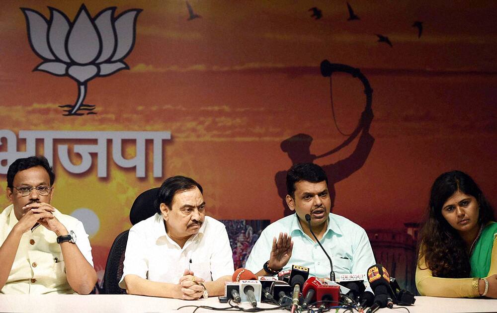 BJP leaders Vinod Tawde, Eknath Khadse, Devendra Fadnavis and Pankaja Munde during a press conference in Mumbai.