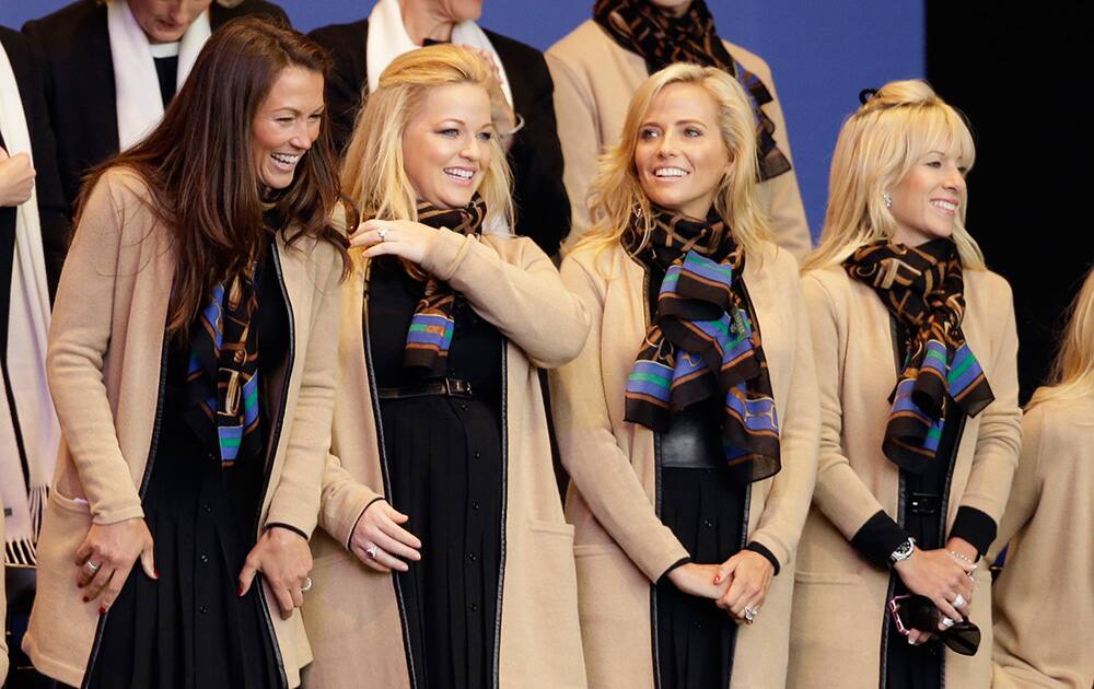 Sybi Kuchar, wife of Matt Kuchar, Kandi Mahan, wife of Hunter Mahan, Amy Mickelson, wife of Phil Mickelson and Justine Reed, wife of Patrick Reed attend the opening ceremony for the Ryder Cup golf tournament at Gleneagles, Scotland.