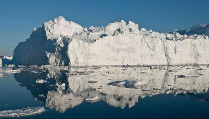 Land-ice decay behind fast sea level rise