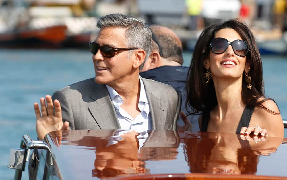 George Clooney and Amal Alamuddin arrive in Venice, Italy. Clooney, 53, and Alamuddin, 36, are expected to get married this weekend in Venice, one of the world’s most romantic settings. 