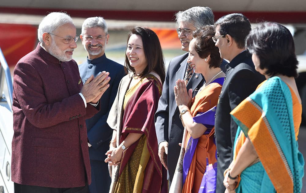 Prime Minister Narendra Modi being welcomed by Indian Ambassador to US Subrahmanyam Jaishankar, his wife Kyoko Jaishankar and Indias Ambassador to the UN Asoke Mukerji, on his arrival at John F Kennedy International Airport in New York on Friday to attend 69th session of the United Nations General Assembly. 