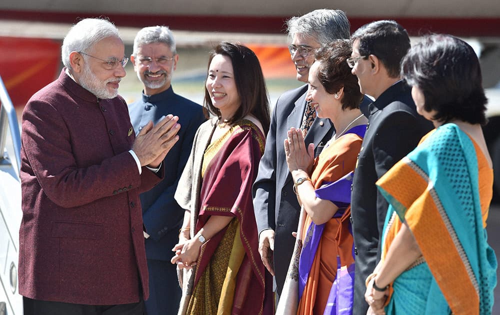 Prime Minister Narendra Modi being welcomed by Indian Ambassador to US Subrahmanyam Jaishankar, his wife Kyoko Jaishankar and Indias Ambassador to the UN Asoke Mukerji, on his arrival at John F Kennedy International Airport in New York on Friday to attend 69th session of the United Nations General Assembly. 