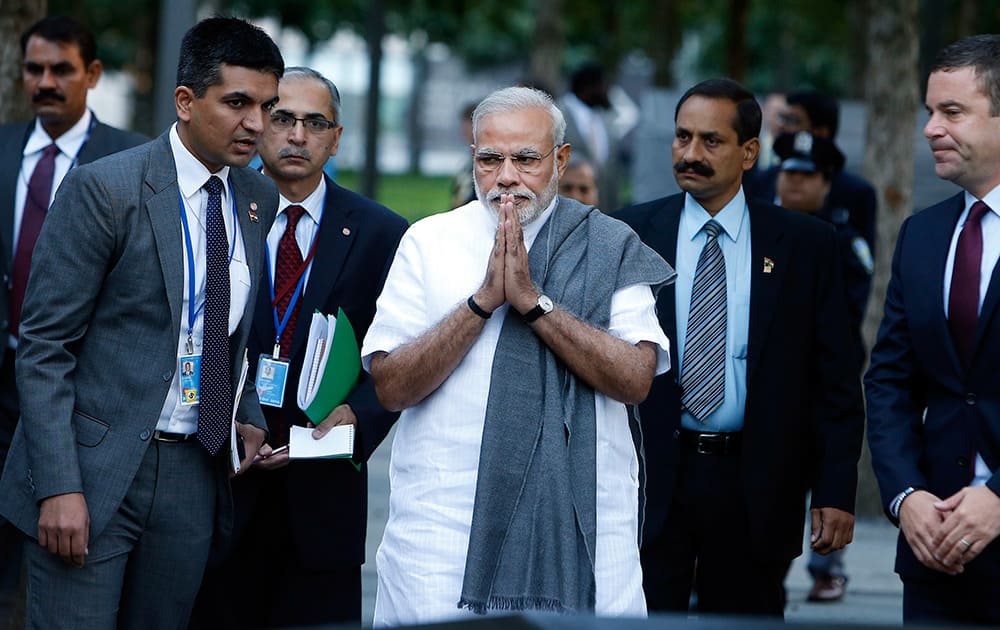 Prime Minister Narendra Modi of India, center, arrives for a visit to the National September 11 Memorial.