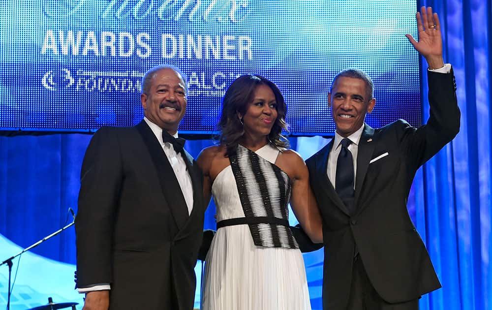 President Barack Obama, right, and first lady Michelle Obama, center, stand with Rep. Chaka Fattah, D-Penn., left, at the Congressional Black Caucus Foundation’s 44th Annual Legislative Conference Phoenix Awards Dinner in Washington.
