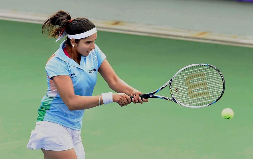 Tennis player Sania Mirza in action against Chinese Taipeis Chin Wei Chan and Su Wei Hsiehin during womens doubles semi-final match at Asian Games in Incheon on Sunday. Indian pair of Sania Mirza and Prarthana Thombare settled for a bronze after losing the match.
