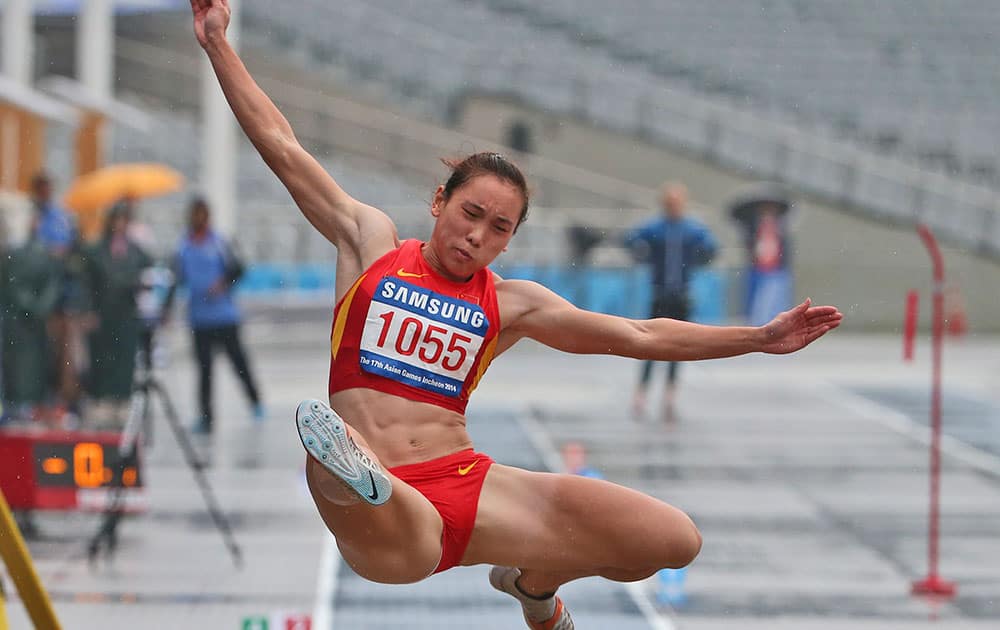 China's Wang Qingling competes in the women's heptathlon long jump at the 17th Asian Games in Incheon, South Korea.