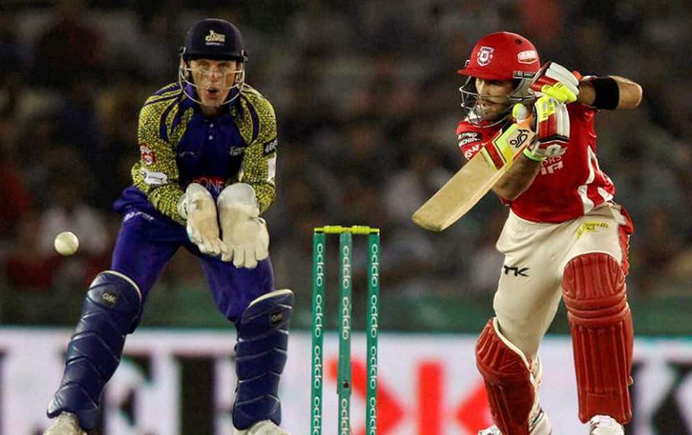 Maxwell of the Kings XI Punjab pushes a delivery into the covers during Champions League Twenty20 match against Cape Cobras in Mohali.