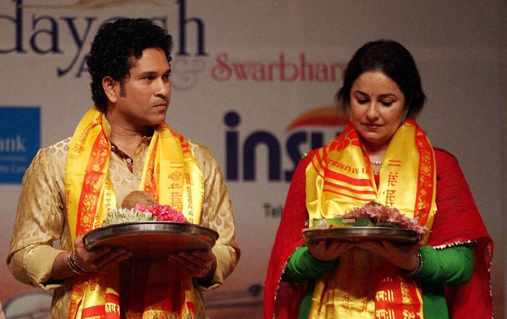 Cricketer Sachin Tendulkar and his wife Anjali during legendary singer Lata Mangeshkars 85th birthday celebrations in Mumbai.