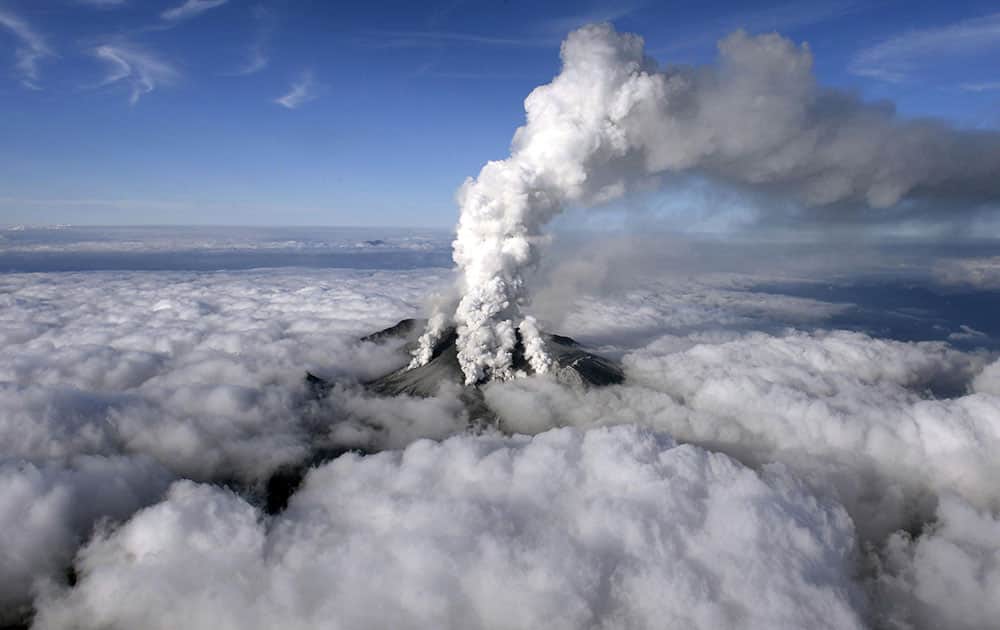 Dense white plumes rise high in the air as Mt. Ontake erupts in central Japan.