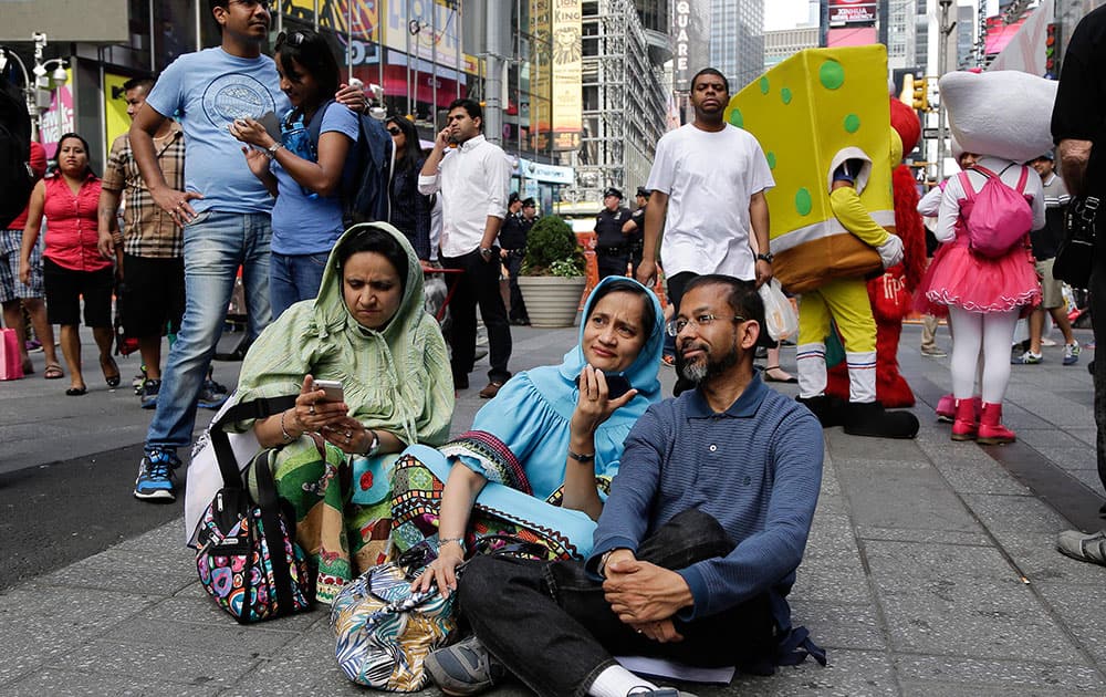 Members of the Indian-American community gather in Times Square to watch a live stream of Indian Prime Minister Narendra Modi who spoke to a capacity crowd at Madison Square Garden.